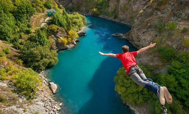 Man doing bungee jump from Kawarau Bridge Bungy in Queenstown, New Zealand