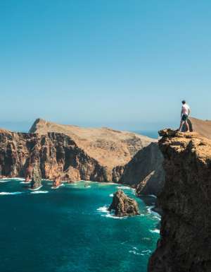 Man standing on cliff in Madeira