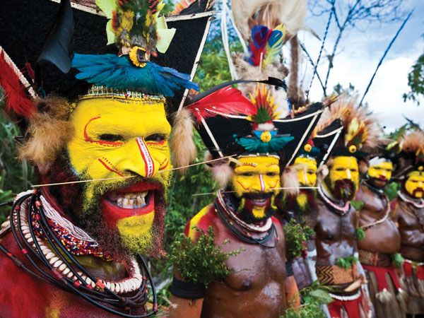 masked men at Marquesas Art Festival