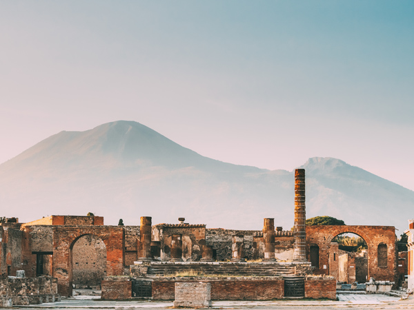a temple in Pompeii with a view of Mount Vesuvius
