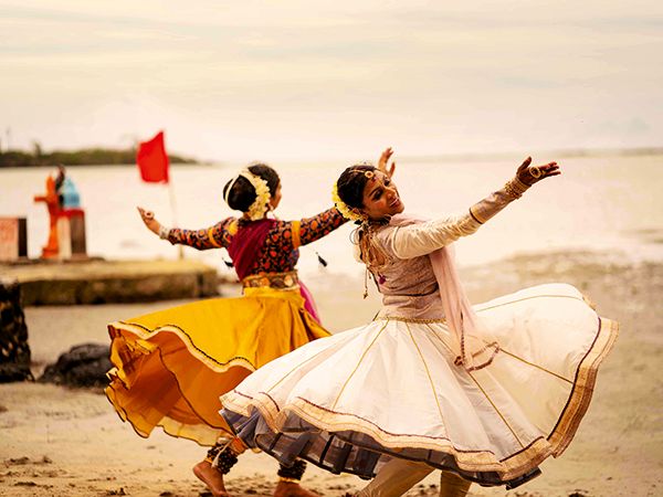 Two ladies dancing for the Diwali festival 