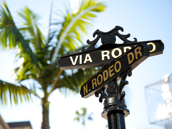 the Rodeo sign on the street corner