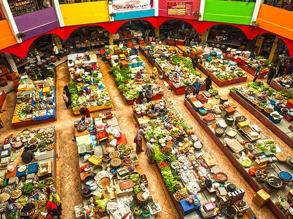 a vibrant array of fruits and vegetables at Siti Khadijah Market in malaysia