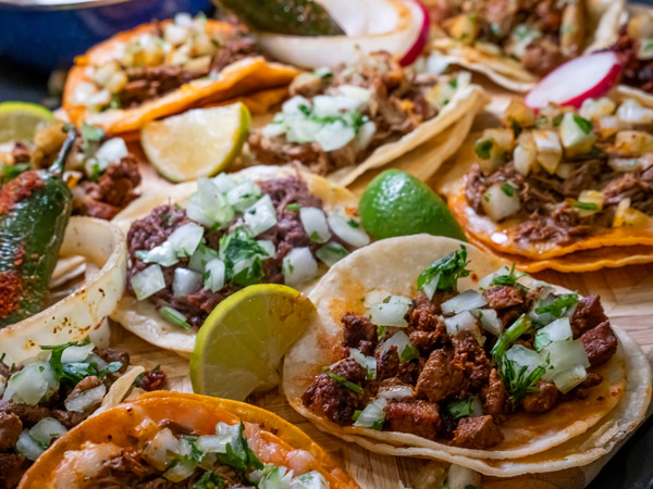tacos with lime, onion and roasted chili pepper