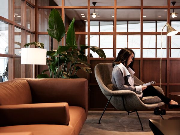 a woman relaxing at the Deck, Cathay Pacific Business lounge