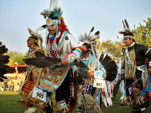 tribal dancers gather at United Tribes Technical College (UTTC) International Powwow
