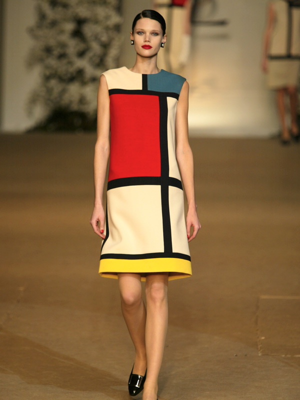 a model wearing a dress at Yves Saint Laurent Museum