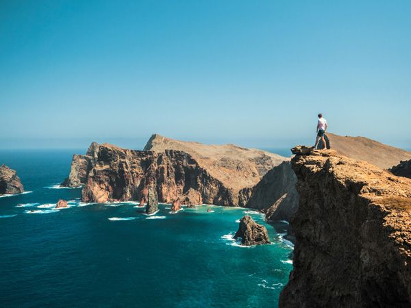 Man standing on cliff in Madeira