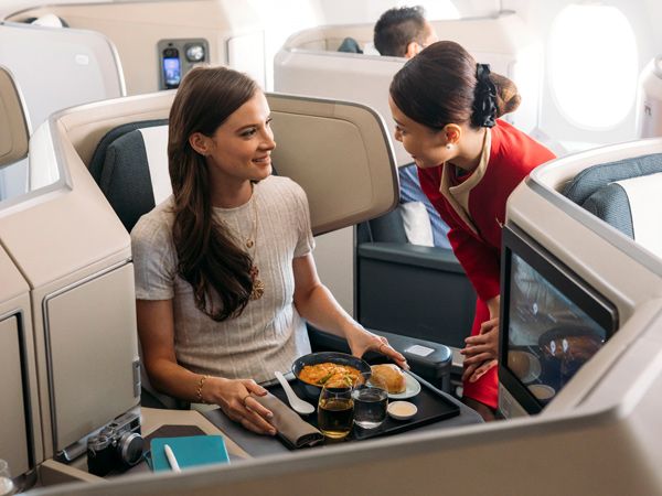 a Cathay Pacific crew serving inflight meals