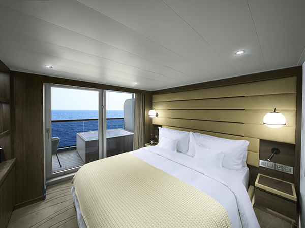 The bedroom with the view of the ocean and the private plunge whirlpool.