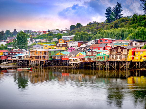 colourful palafitos houses perched on stilts at Chiloé Island, Chile