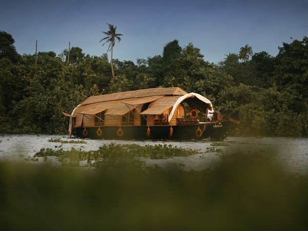 a traditional houseboat along the Kerala backwaters