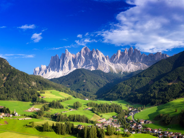 a scenic mountain landscape surrounding Val di Funes, Dolomites, Italy