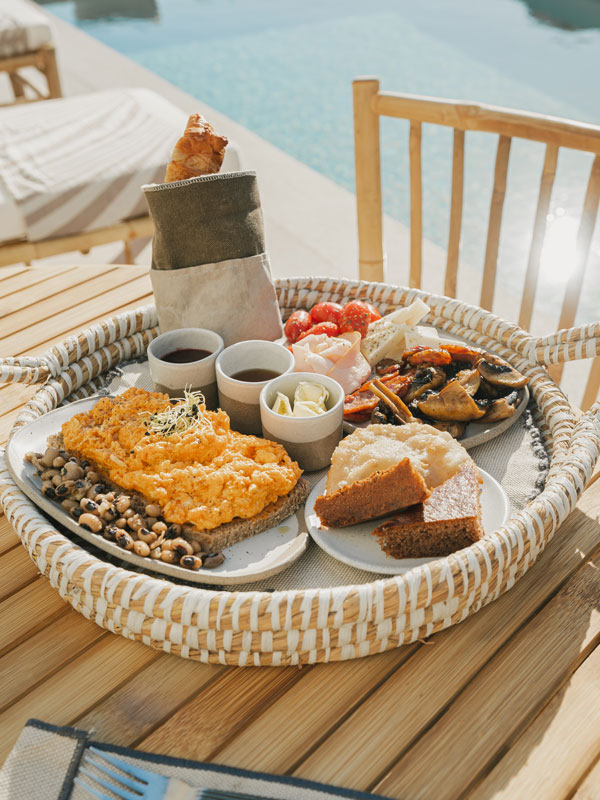 a meal platter by the pool at White Pebble Suites, Milos, Greece