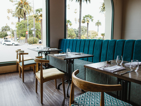 the dining tables and chairs at Central Fire Station Bistro