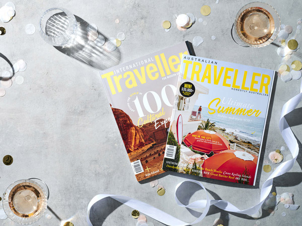 Australian Traveller issue 104 and International Traveller issue 52 on a flatlay.