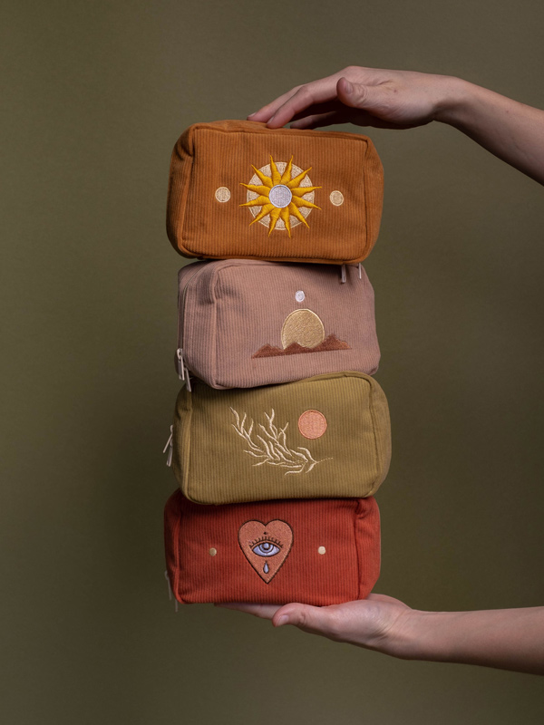 a hand holding stacked goods from Hunter & Hare, Vancouver