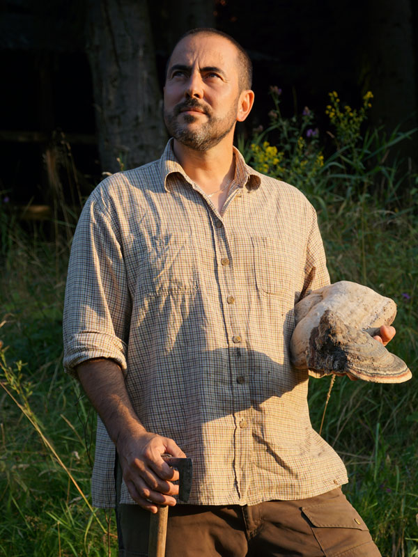 biologist István Moldován holding conk