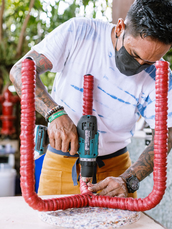 a resort staff making a stool