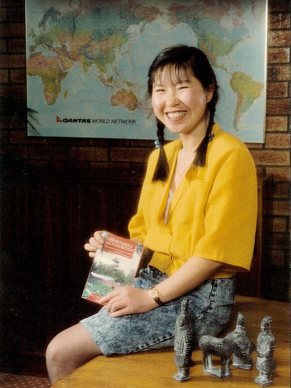 a photo of Wendy Wu sitting at her Sydney office