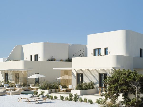 the white-washed exterior of White Pebble Suites, Milos, Greece