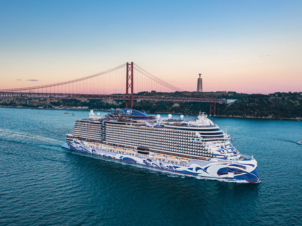 the Norwegian Viva ship sailing across Lisbon