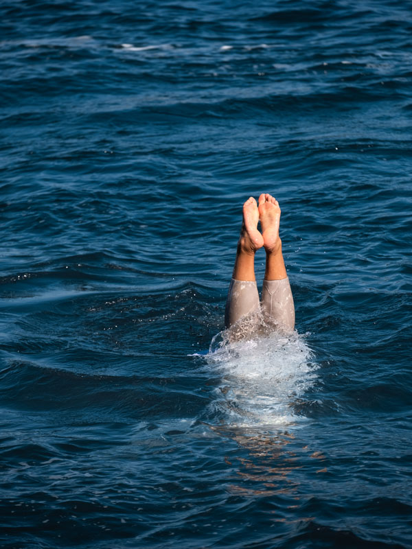 an ama diver with her feet up in Mikimoto Pearl Island