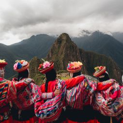 Quechua women from the Sacred Valley with arms linked