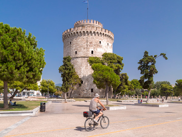 biking in front of the White Tower of Thessaloniki