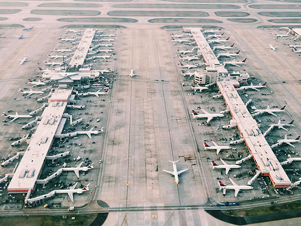 planes in the hangars at an airport