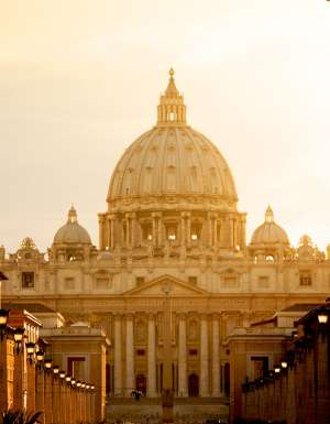 St. Peter's Basilica at sunset from Via della Conciliazione. Vatican City State. Rome, Italy.