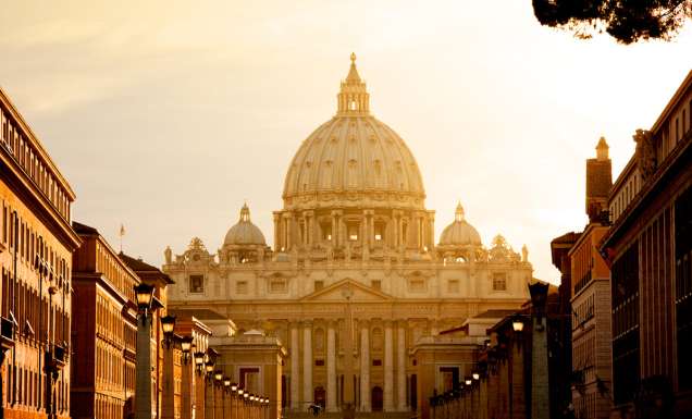 St. Peter's Basilica at sunset from Via della Conciliazione. Vatican City State. Rome, Italy.