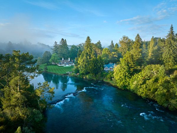 an aerial view of Huka Lodge on Waikato River in Taupo, New Zealand