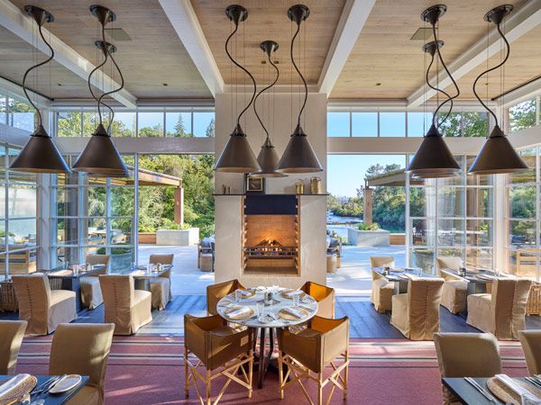 the dining room with copper and brass pendant lights at Huka Lodge, New Zealand