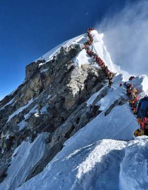 People queuing to reach Mount Everest Summit/Top of the World / Highest Mountain in the Himalayas Nepal