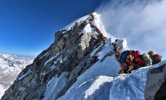 People queuing to reach Mount Everest Summit/Top of the World / Highest Mountain in the Himalayas Nepal