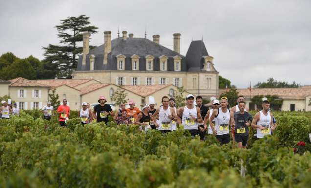 Runners in the Marathon du Médoc in Bordeaux, France