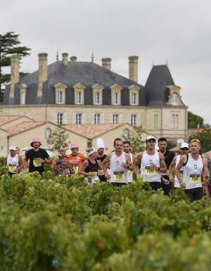 Runners in the Marathon du Médoc in Bordeaux, France