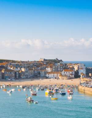 The charming boats and golden sands of St Ives Harbour in Northern Europe and the UK.
