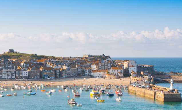 The charming boats and golden sands of St Ives Harbour in Northern Europe and the UK.