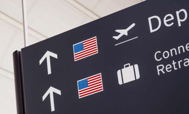 Sign with American flag at airport