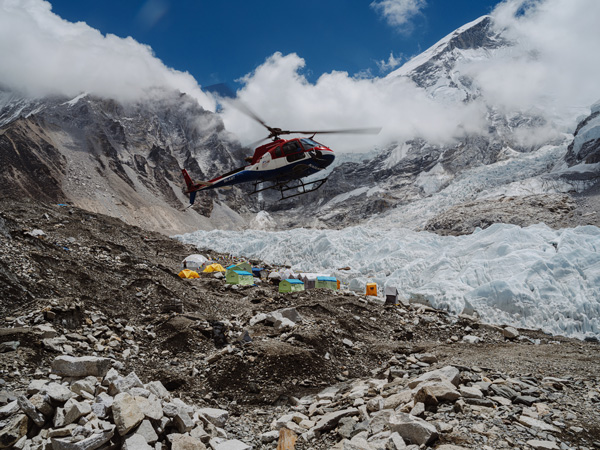 Helicopter lands at Everest Base Camp