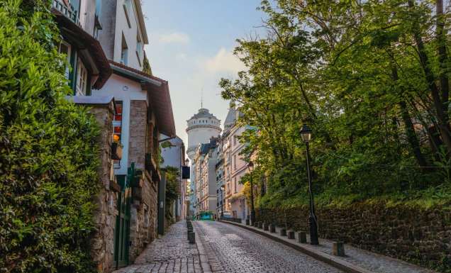 Montmartre Water Tower on a Charming Cobblestone Street in Paris