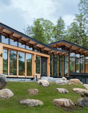 Exterior of Barlochan Cottage in Torrance, located on Walkers Point on the west shore of Lake Muskoka, Ontario, Canada. The Heated Rivalry cottage