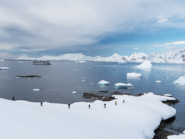 skiing in antarctica with aurora