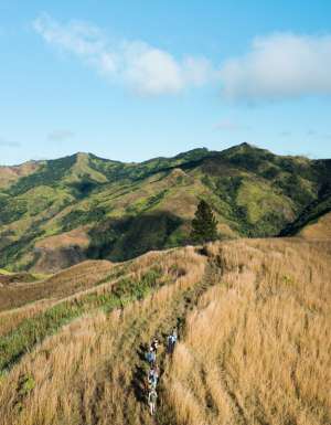 Hiking group through Fiji Highlands via a drone