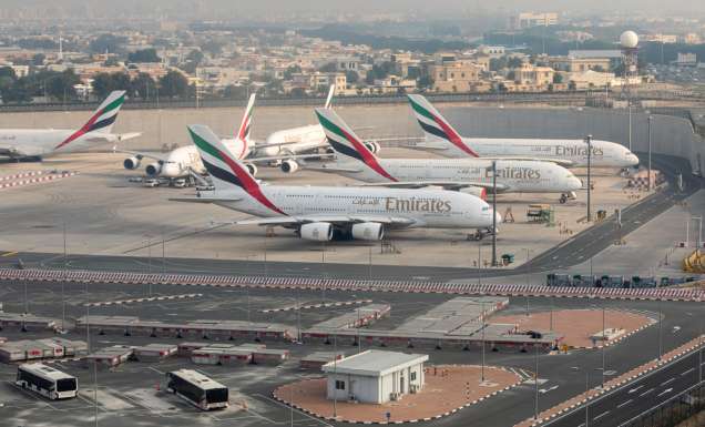 Emirates airplanes parked at Dubai International Airport
