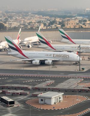 Emirates airplanes parked at Dubai International Airport