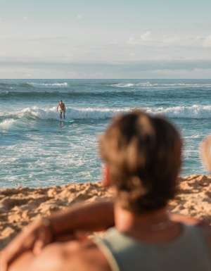 watching a surfer at Sunset Beach, Oahu