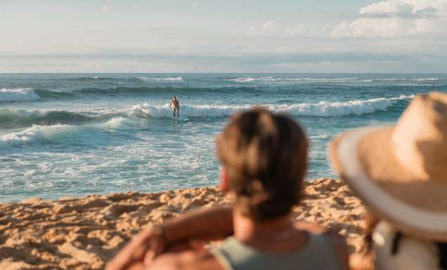 watching a surfer at Sunset Beach, Oahu